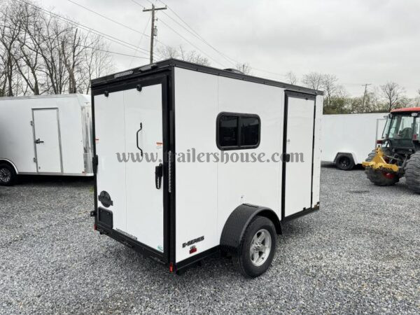 2024 Cargo Mate 5.5x10' Enclosed Toy Hauler Trailer 2990# GVW * TOY HAULER * FOLD OUT BED * WHITE BLACKOUT * SLANT V-NOSE * ALUMINUM WHEELS * .030 SCREWLESS EXTERIOR * REAR SPOILER * PLYWOOD FLOORS/WALLS * TABLE * MAX AIR COVER * EXTRA HEIGHT - Image 12